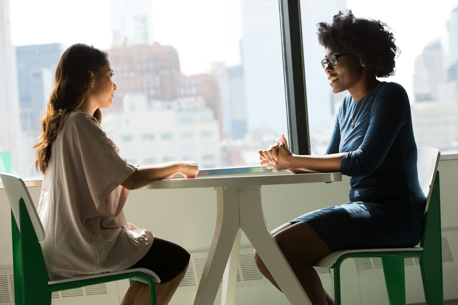 Two people sitting together and talking